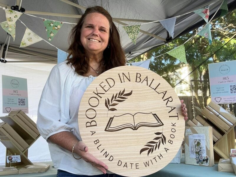 Amanda holding Booking in Ballarat sign