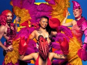 4 Performers in crustacean themed costumes with bright feather fans