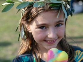 A girl smiles with an ice-cream