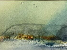Watercolour painting of a coastal headland with birds flying above the shoreline in soft green and b