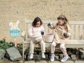 Children looking at eggs they found after an easter egg hunt