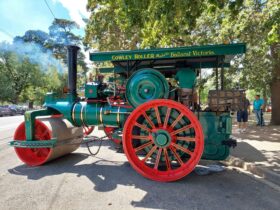 photo of an early steam powered road roller