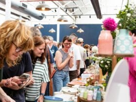 Crowds browsing handmade ceramics at the Geelong Ceramics Market inside Furphy Hall