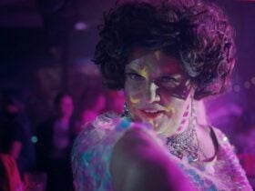 Dolly Diamond posing in a crowd.