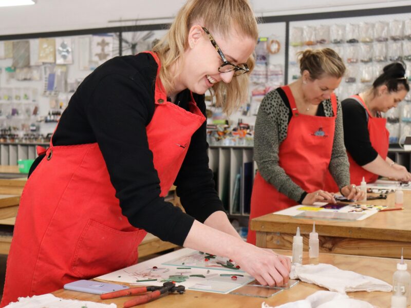 A student working on their fused glass platter in our kyneton studio