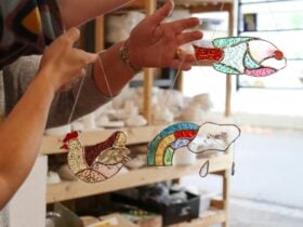 Colourful glass lightcathers of a rainbow, fish and chicken