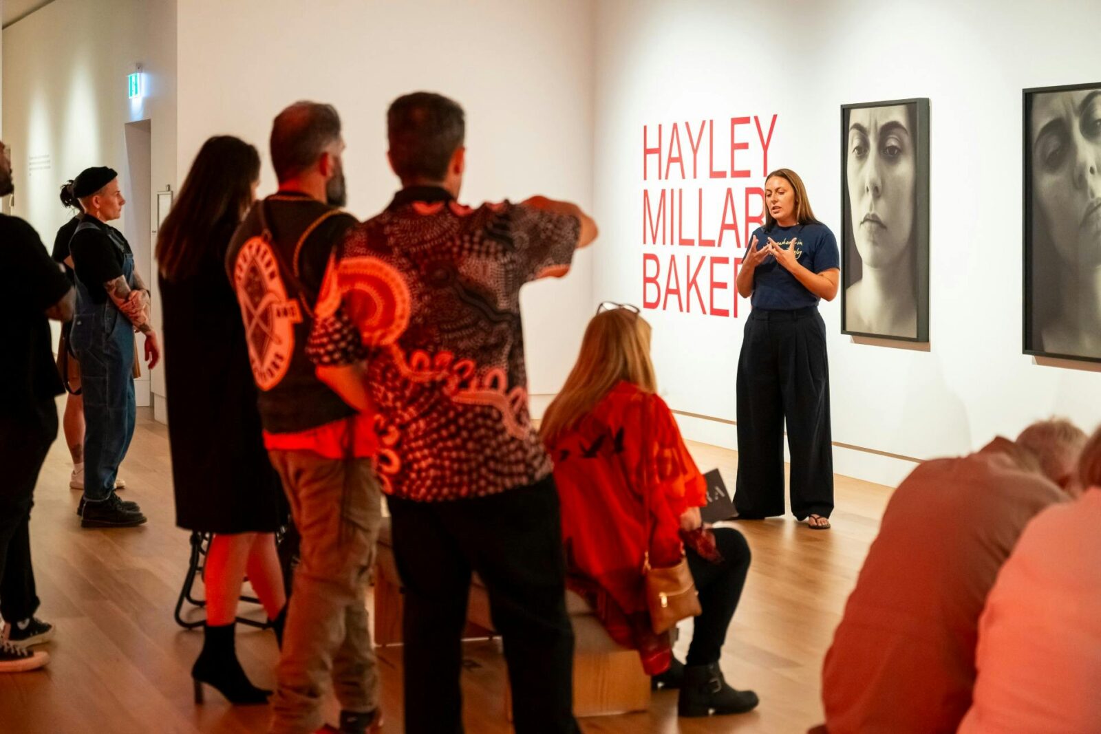 people standing listening to talk
