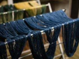 Blue yarn drying on racks