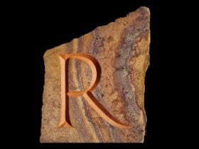 Hand carved letter R in stone