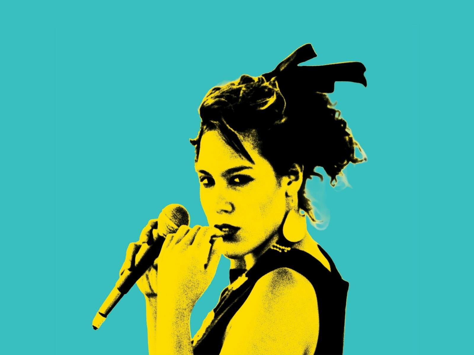 Kate standing in front of an aquamarine blue background