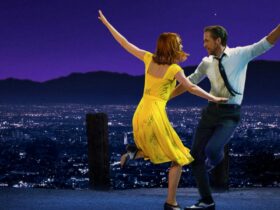 man and woman dancing infront of LA skyline