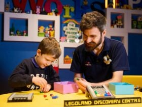 Master Model Builder and child building LEGO
