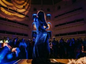 A performer dancing under State Library Victoria