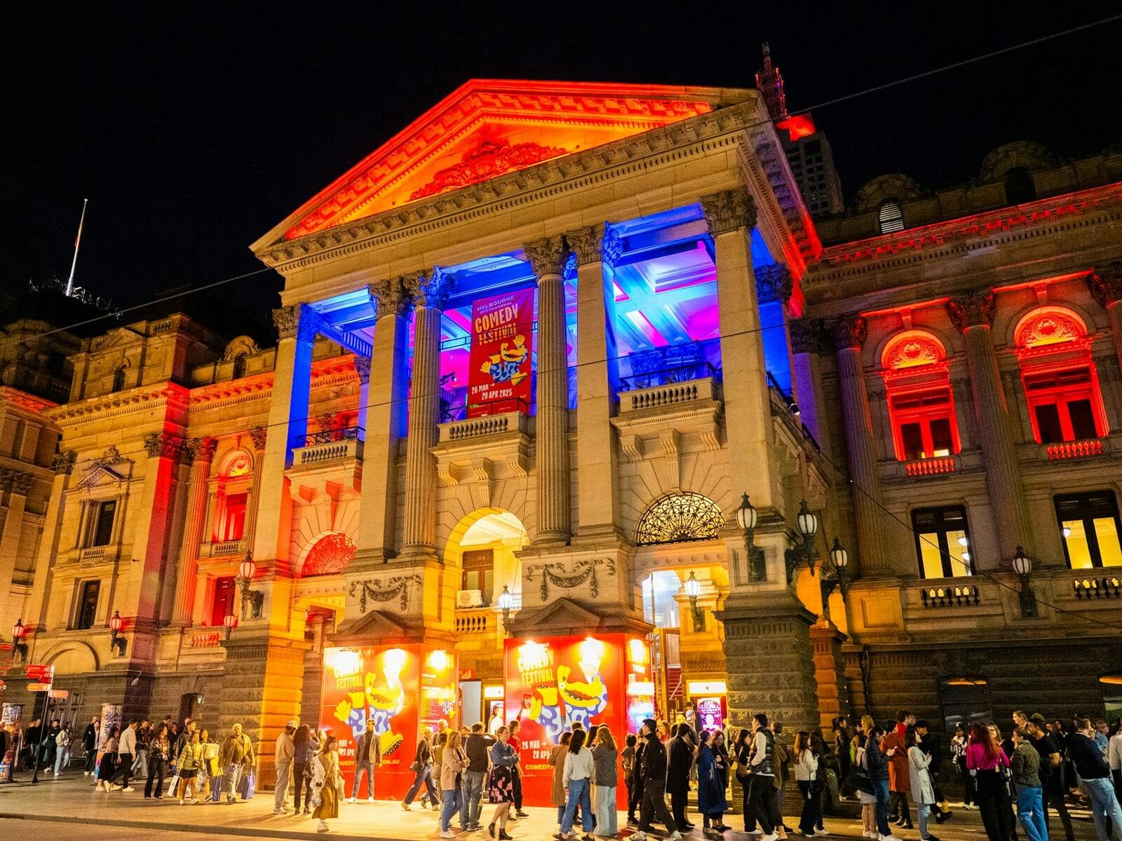 Town Hall with Comedy Branding and crowds