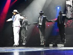 Garth Field as Michael Jackson and backup dancers performing on stage.