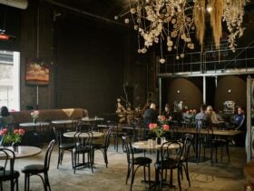 The dining room with hanging floral installation