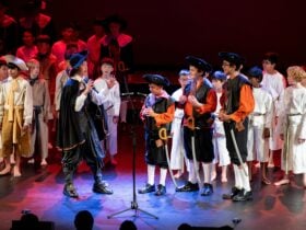 Photo of boys signing dressed in costume