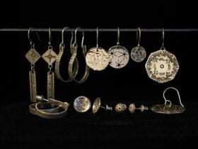 Hoop, dangling and stud earrings lined in a row