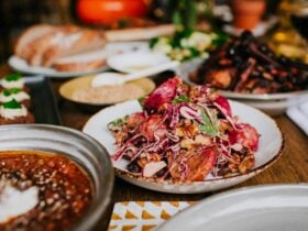 A table spread of bright wholesome dishes presented across a table.