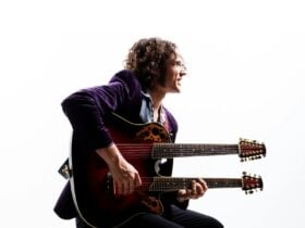 Musician RIFF with a double neck guitar