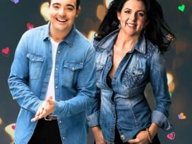 A man and a lady looking at the camera, smiling.