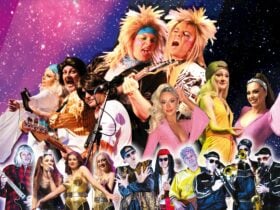 Members from BigCityBeat dressed up in costumes from ths 70s, 80s and 90s with instruments, in front