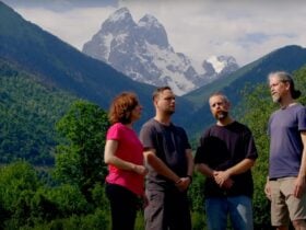 4 people standing in front of mountains in Svaneti in Georgia.