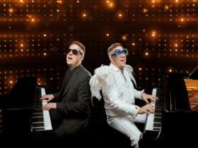 Jason Dean dressed as Billy Joel and Elton John playing piano