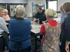 Chef Mark show how to knead gnocchi to the cooking class students