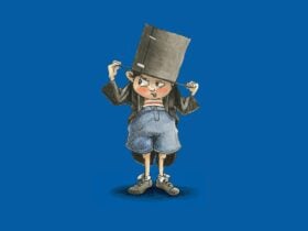 A young boy with a cardboard top hat, standing in front of giant letters 