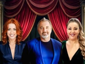 Julia Cartagena, Donna Maree Richardson, and Anthony Grzelka posing in front of red curtain.