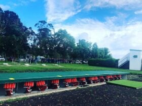 Wide view of trench layout at Melbourne Gun Club with crowd gathered for competition