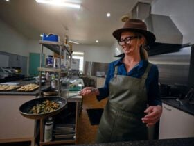 Person cooking a dish in a commercial kitchen