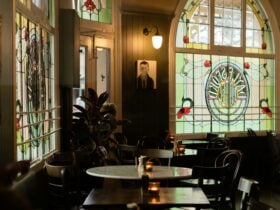 A dining room with beautiful leadlight windows