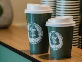 Take away coffee cups, branded Maggie & Kate containing Allpress coffee