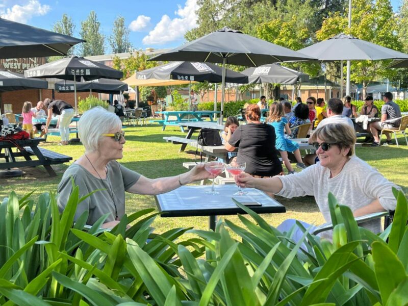 Photo of the Mountain Monk Brewers Beer Garden, with patrons enjoying their lunch and drinks.