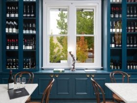 RJMs Wine bar front dining area & wine racks, looking out front windows