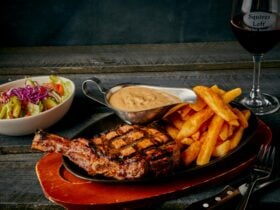 Ribeye steak with chips, sauce & salad