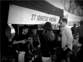 St Ignatius Team offering wine tastings to customers