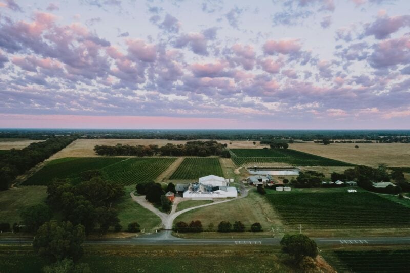 A drone image of Stanton & Killeen Wines showing a beautoful purple sunrise.