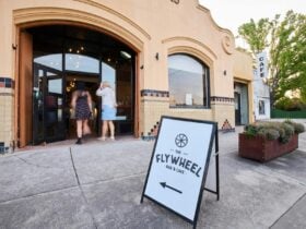 Two characters entering cafe from street frontage