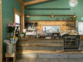 a store counter with a green painted wall in the background