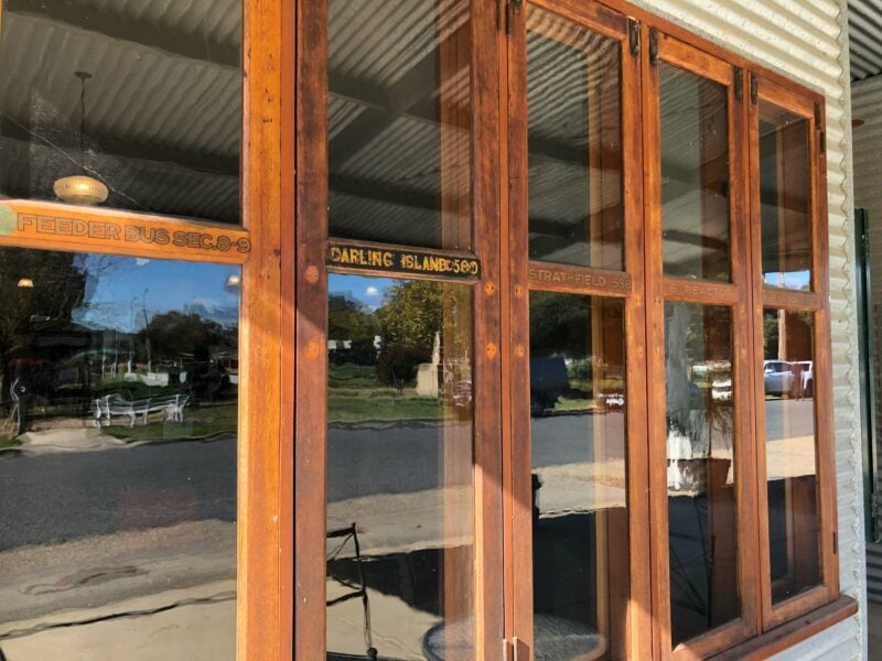 Wood-framed windows at the front of the cafe.