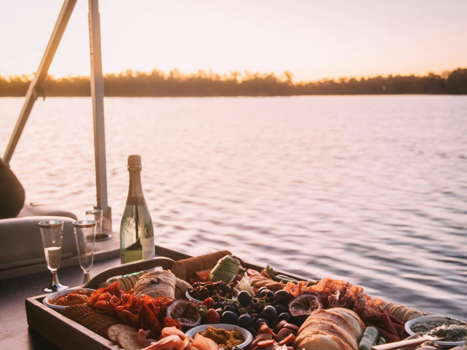 Group enjoying a sunset cruise on the Goulburn River luxury pontoon boat