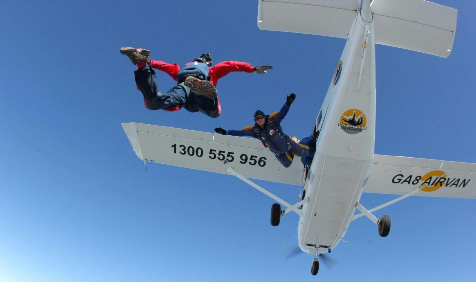 Skydivers leaving plane