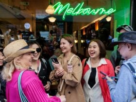 Melbourne visitors enjoying a moment outside a famous Melbourne cafe laneway