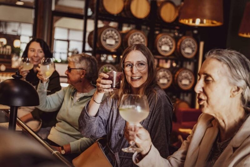 Four women enjoying drinks