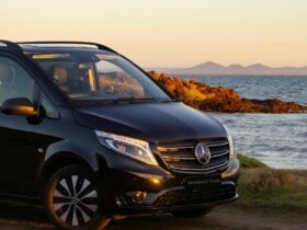 Black Van parked along the coast