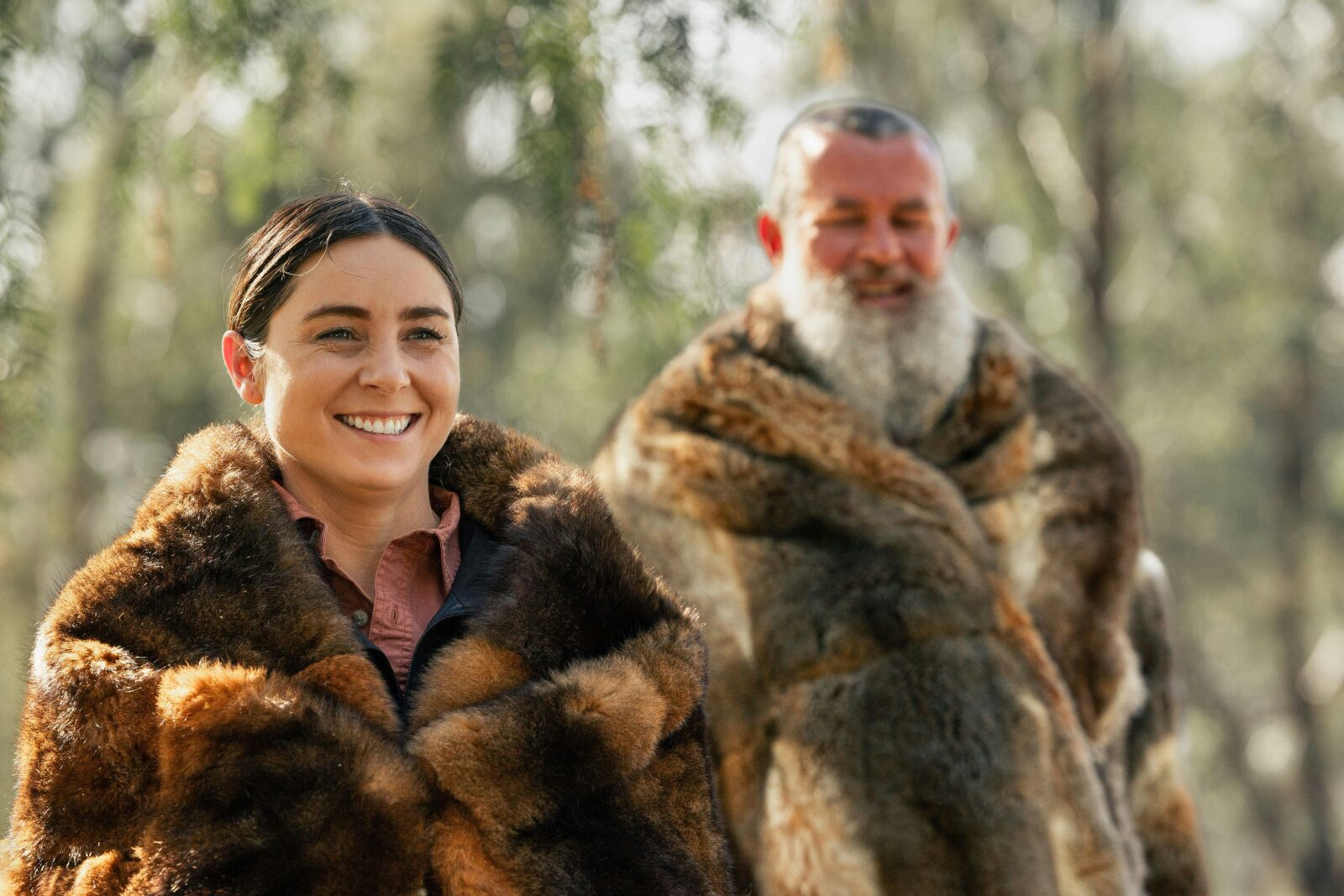proud guides in possum skin cloaks