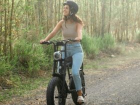 Girl riding on a track through bush on an e-Bike